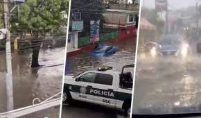 El auto azul quedó debajo del agua, tras loas lluvias de este martes